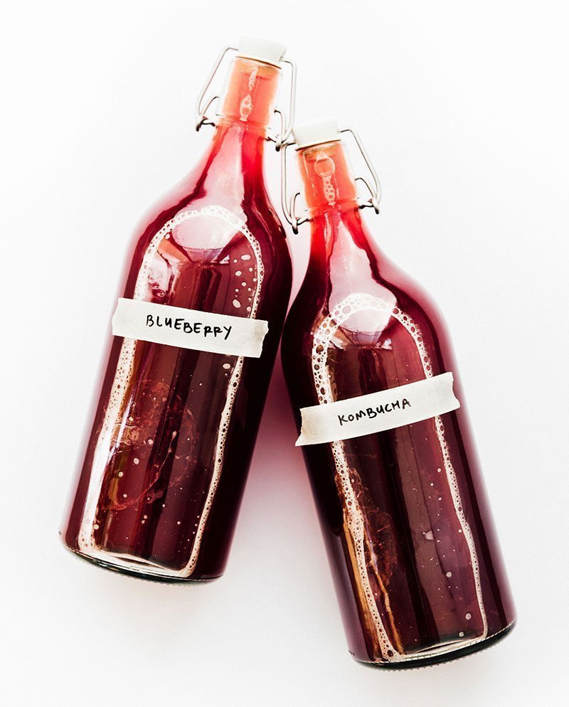blueberry kombucha in glass fermentation bottles