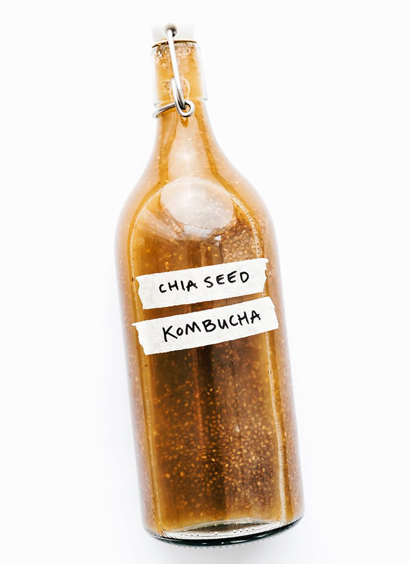 Bottle of chia seed kombucha on white background