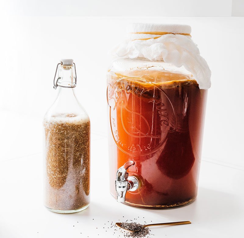 Bottle of chia seed kombucha on white background