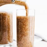 Pouring chia seed kombucha into glass
