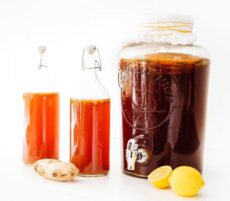 lemons, ginger, and kombucha in bottles