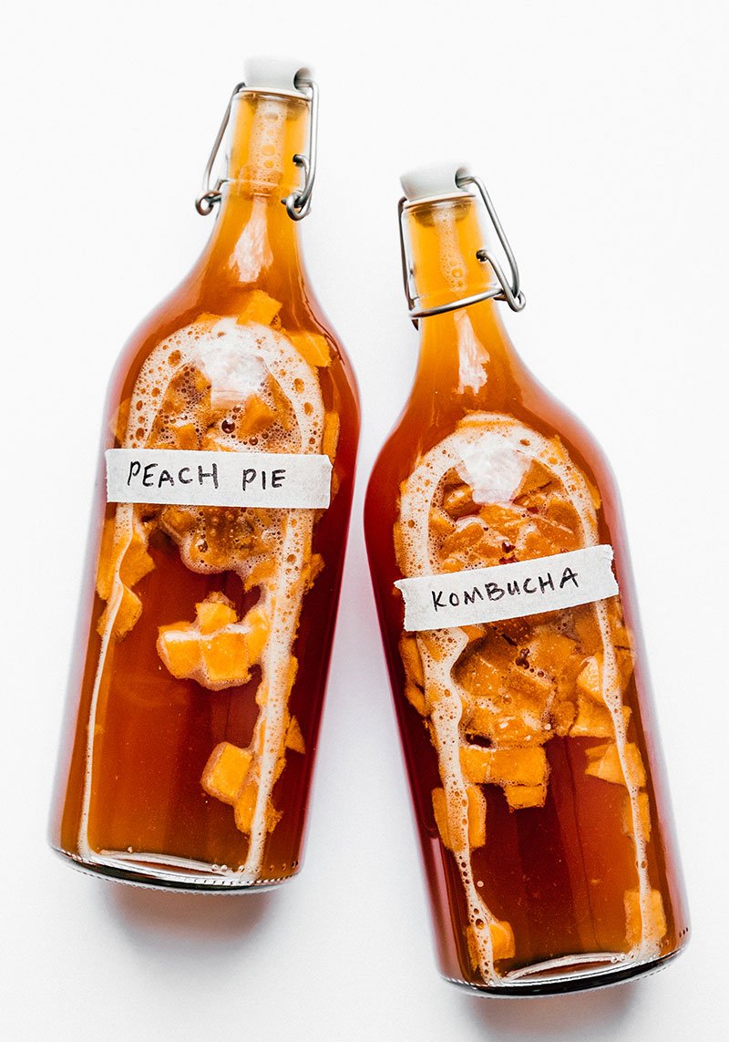 vanilla peach kombucha in fermentation bottles

