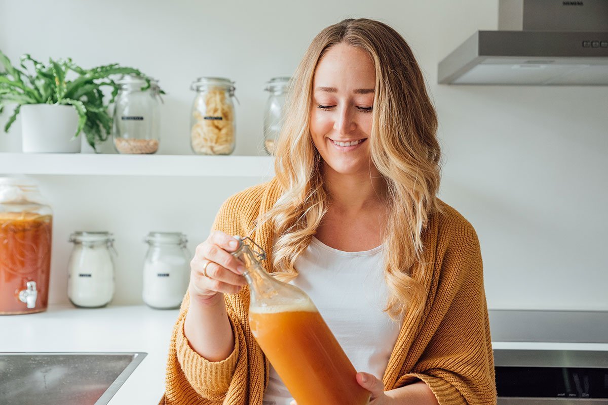 Sarah Bond with bottle of kombucha