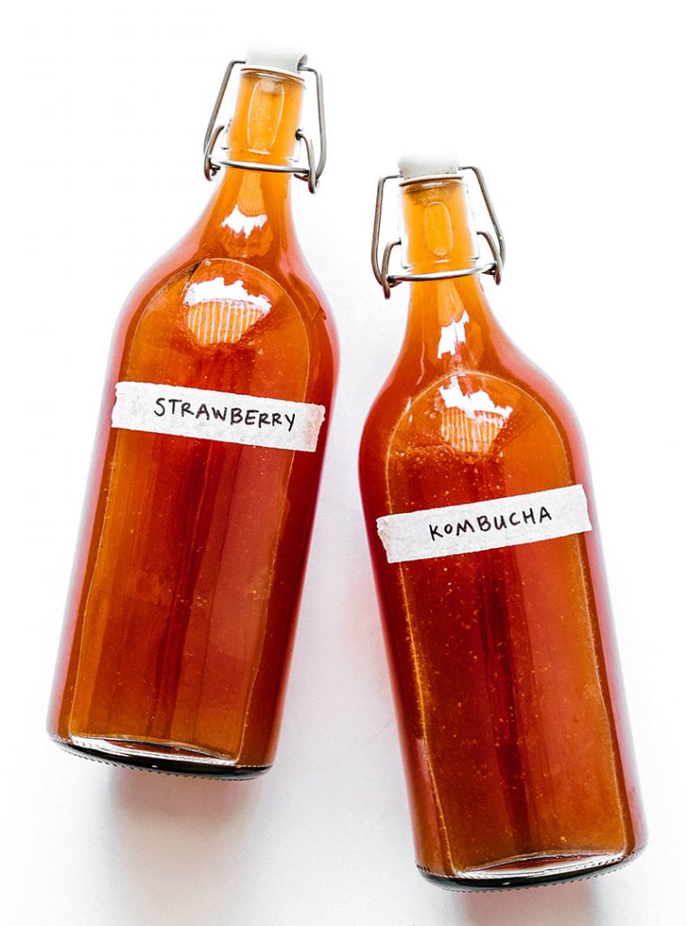 strawberry kombucha in fermentation bottles