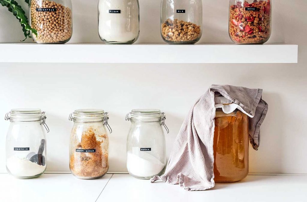 Kombucha on a counter covered with a cloth