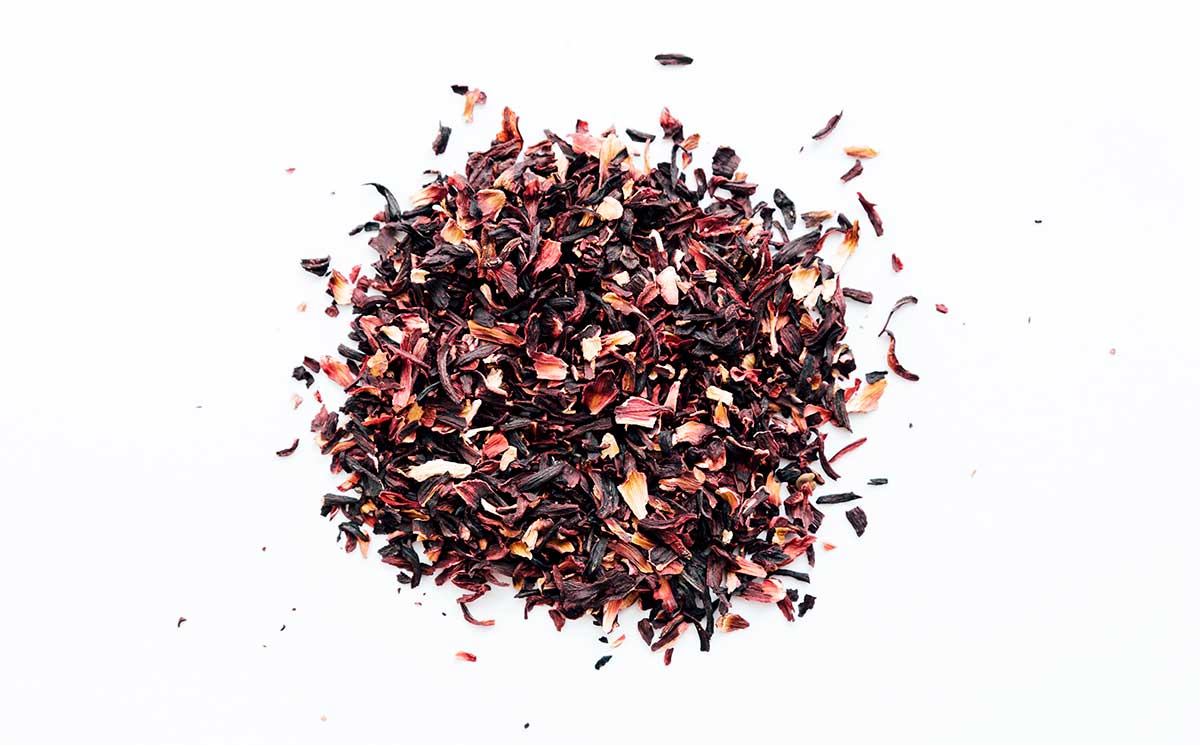 Dried hibiscus flowers on a white background