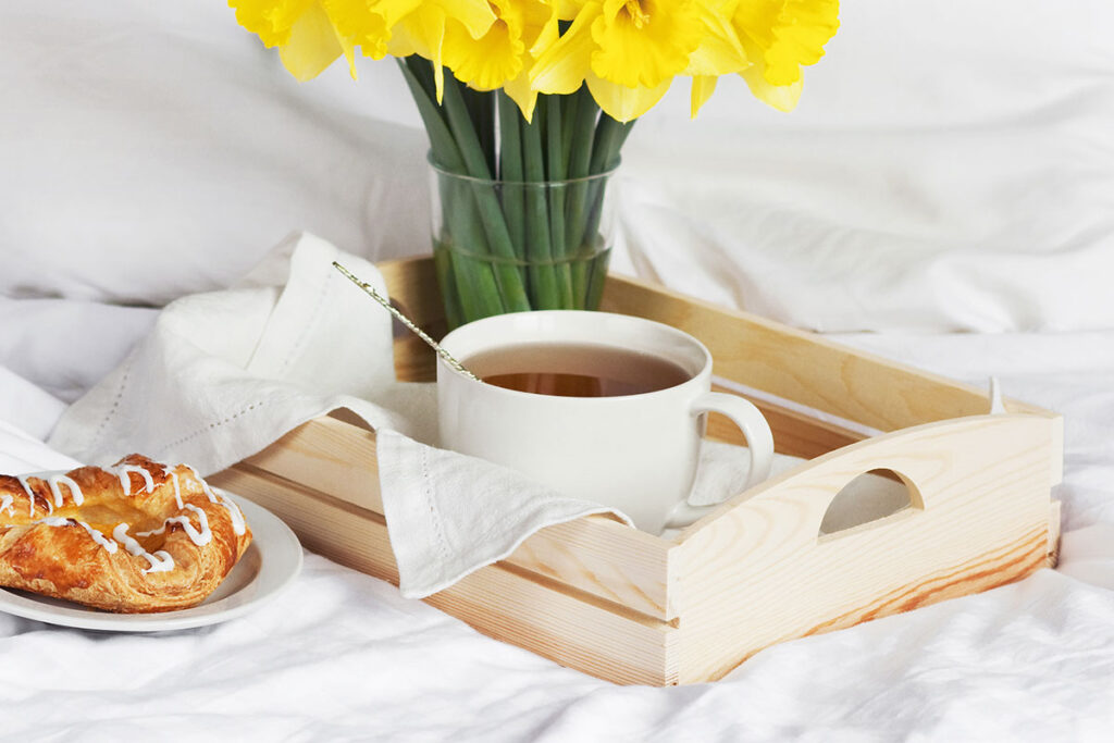 Breakfast tea on a bed.