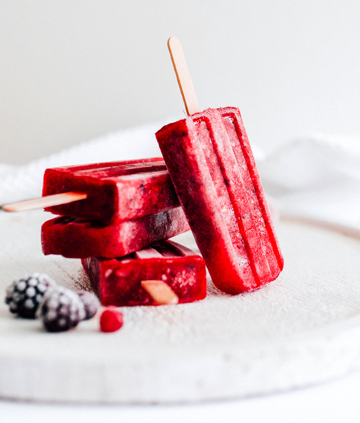 Red kombucha popsicles stacked.