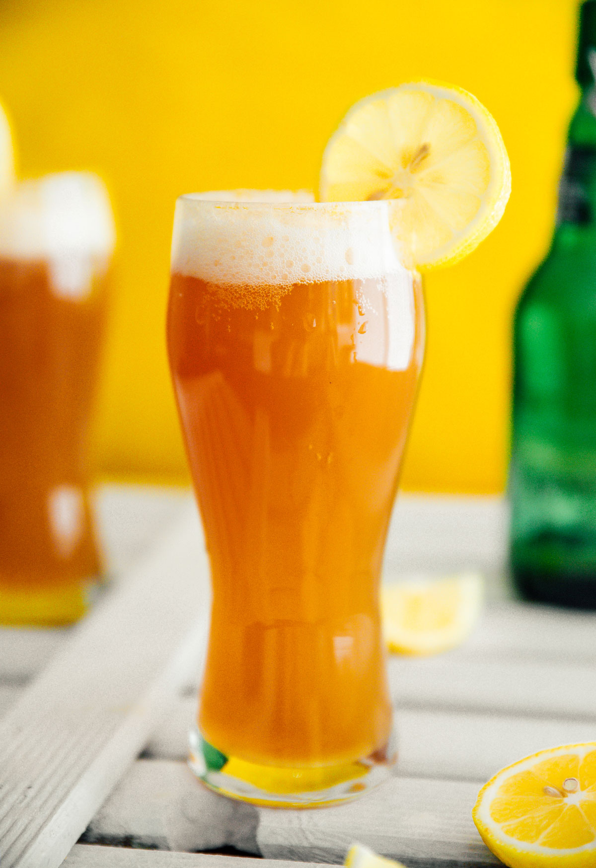 Kombucha beer shandy in a glass with a lemon