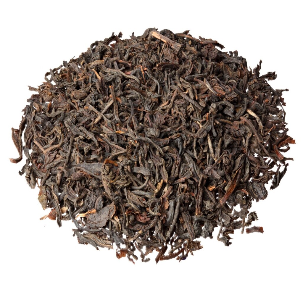 Assam tea leaves on an isolated white background.