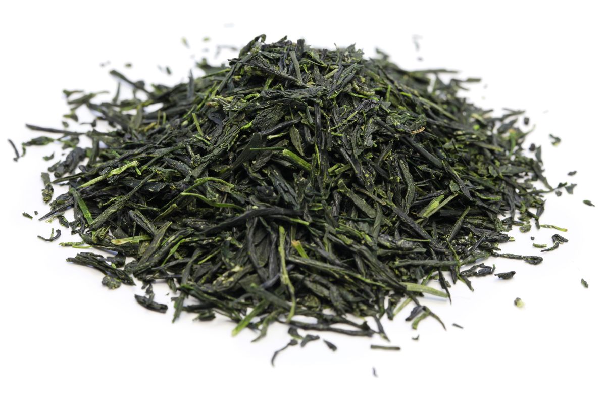 Gyokuro tea leaves on an isolated white background.
