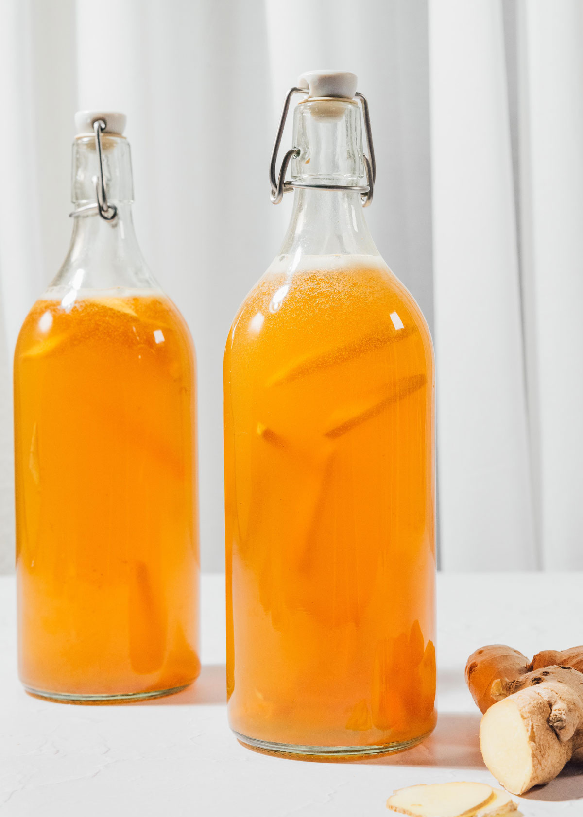 Fizzy ginger kombucha in bottles.