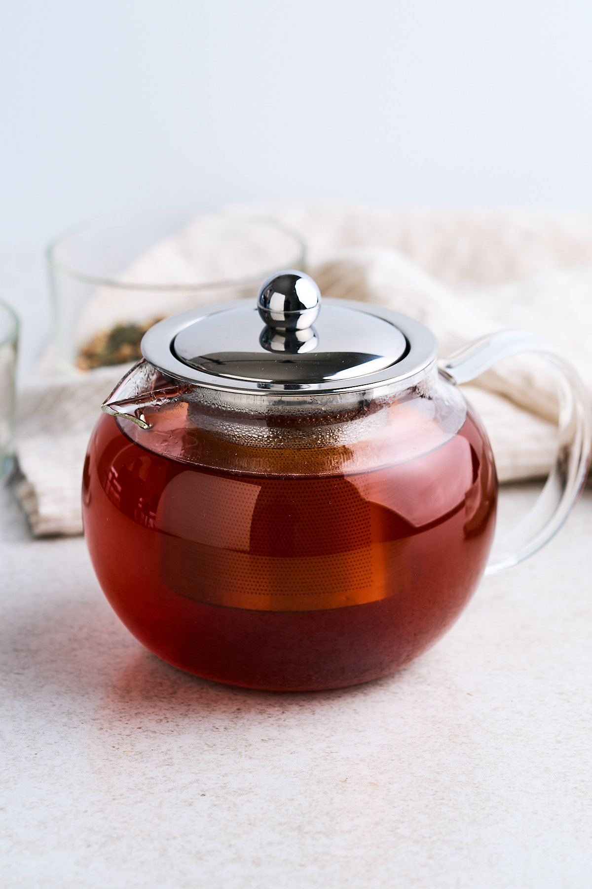 Black tea in a glass tea pot.